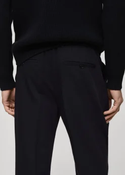 MANGO Spodnie*Spodnie regular fit z lejącej tkaniny z zaszewkami